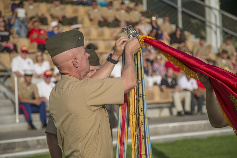 Colonel William H. Vivian, regimental commander, 7th Marine Regiment, rededicates the regimental battle colors at Lance Cpl Torrey L. Gray Field, Marine Corps Air Ground Combat Center, Twentynine Palms, Calif., Sept. 15th, 2017. The 7th Marine Regiment celebrated its 100th anniversary with a rededication of battle colors and a parade of troops. (U.S. Marine Corps photo by Lance Cpl Preston Morris)