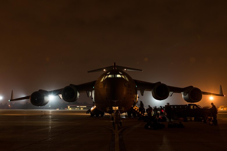 Members of an U.S. Agency for International Development elite disaster board a Travis Air Force Base C-17 Globemaster III at March Air Reserve Base, Calif., Sept. 20, 2017. At the request of the Mexican government, the team was headed for Mexico to support search and rescue efforts after a 7.1 magnitude earthquake struck the country.  (U.S. Air Force photo by Master Sgt. Joseph Swafford)