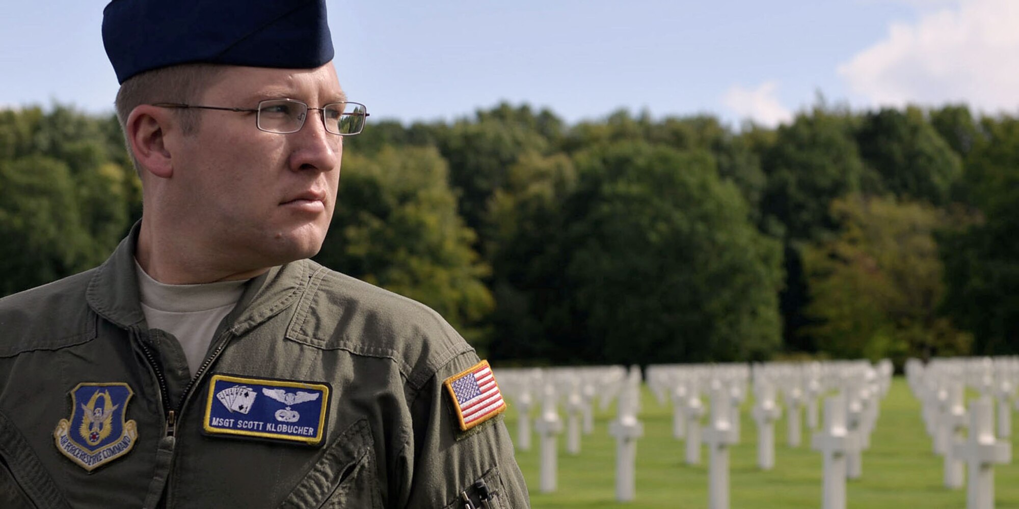 U.S. Air Force Reserve Master Sgt. Scott Klobucher, a loadmaster assigned to the 327th Airlift Squadron, 913th Airlift Group, takes a moment to reflect on history during a wreath laying ceremony at Ardennes American Military Cemetery in Neupre, Belgium, Sept. 12, 2017. The ceremony honored several squadrons from WWII that have roots back to current units at Little Rock AFB. (U.S. Air Force photo by Airman 1st Class Codie Collins)