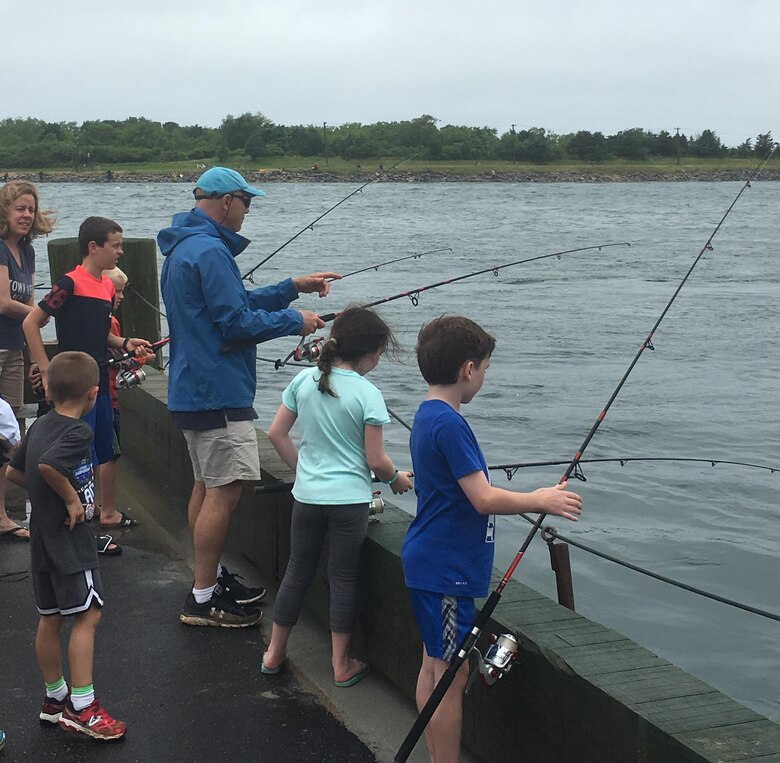 People fishing along the Cape Cod Canal.