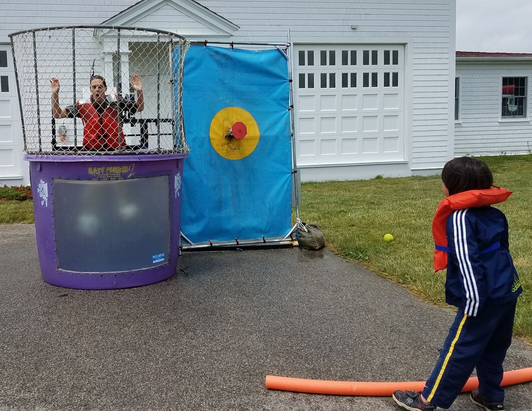 Child dunking ranger in Ranger Dunk Tank