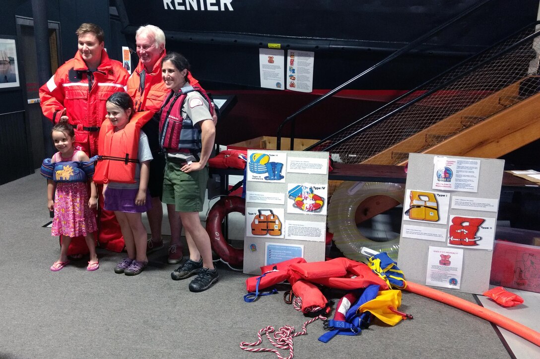 Park Ranger and family with life jackets.