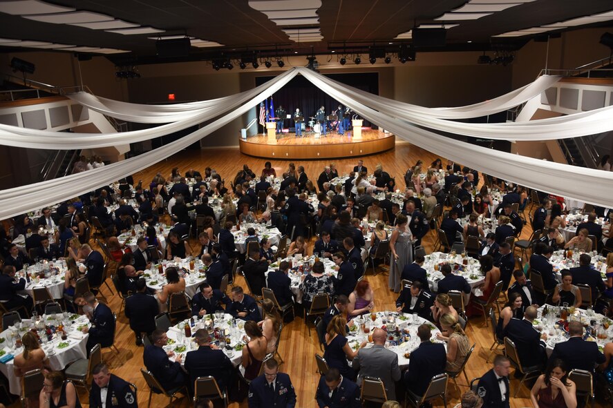 More than 400 Columbus Air Force Base members and community partners gather at the Trotter Convention Center in Columbus, Mississippi, Sept. 15, 2017, to celebrate the Air Force’s 70th birthday. The Trotter Convention Center lobby was lined with a historical display that featured some of the Air Force’s and the base’s key points in its existence and supported the ball’s theme, “Airpower Starts Here.” The event also included a Prisoner of War and Missing in Action remembrance ceremony, formal toasts to leaders of the military services, a ceremonial cake cutting, and music performed live by the 41st Army Band. (U.S. Air Force photo by Melissa Doublin)