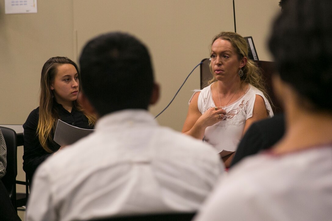 Gunnery Sgt. Beth Pye, chemical, biological, radiation and nuclear subject matter expert, Marine Corps Tactics and Operations Group, explains the importance of finding a proper mentor during the Women’s Leadership Symposium, held aboard the Combat Center, September 15, 2017. The symposium was organized to provide senior ranking female Marines an opportunity to share their experiences and advice with their female subordinates. (U.S. Marine Corps photo by Lance Cpl. Isaac Cantrell)