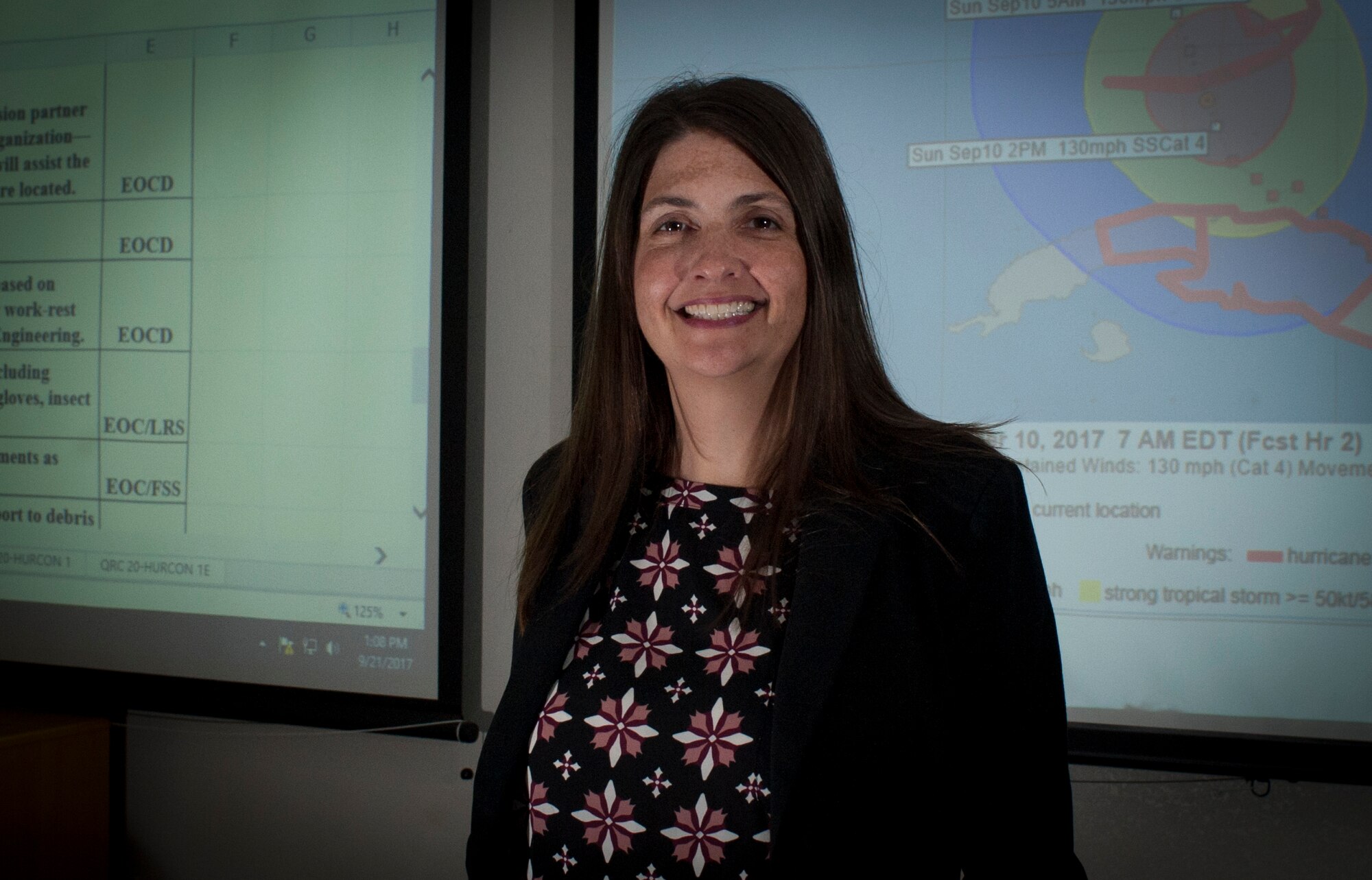 Jadee Purdy, the director of the 6th Civil Engineer Squadron, pauses for a photo in the emergency management building at MacDill Air Force Base, Fla., Sept. 21, 2017. During Hurricane Irma, Purdy performed tasks ranging from emergency operations center director to the chief of the hurricane ride-out team. (U.S. Air Force photo by Senior Airman Mariette Adams)