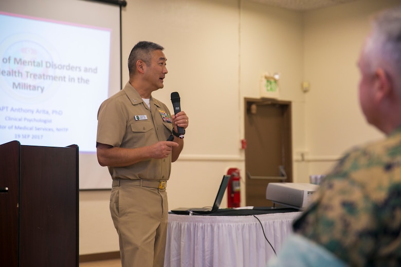 Capt. Anthony Arita, director of medical services, Naval Hospital Twentynine Palms, speaks about the stigmas of mental disorders at the Suicide Prevention Symposium, held aboard the Combat Center, September 19, 2017. The symposium,  organized by the behavioral health branch of Marine Corps Community Services, provided Combat Center leadership with information and resources to aid in dealing with mental health and suicide prevention. (U.S. Marine Corps photo by Lance Cpl. Isaac Cantrell)