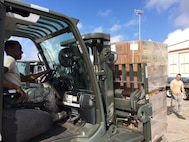 Airman 1st Class Dakwon Aktkinson, 502nd Logistics Readiness Squadron forklift operator, moves cargo around the air operations terminal Sept. 22, 2017 at Joint Base San Antonio-Kelly Field.  The cargo was being staged at the Federal Emergency Management Agency’s Incident Support Base at Kelly for transport to areas devastated by Hurricane Maria (U.S. Air Force image/Dan Hawkins)