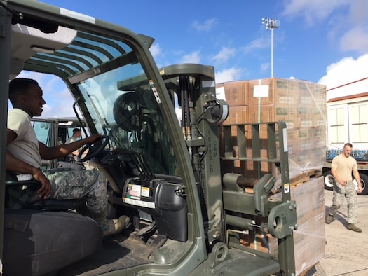 Airman 1st Class Dakwon Aktkinson, 502nd Logistics Readiness Squadron forklift operator, moves cargo around the air operations terminal Sept. 22, 2017 at Joint Base San Antonio-Kelly Field.  The cargo was being staged at the Federal Emergency Management Agency’s Incident Support Base at Kelly for transport to areas devastated by Hurricane Maria (U.S. Air Force image/Dan Hawkins)