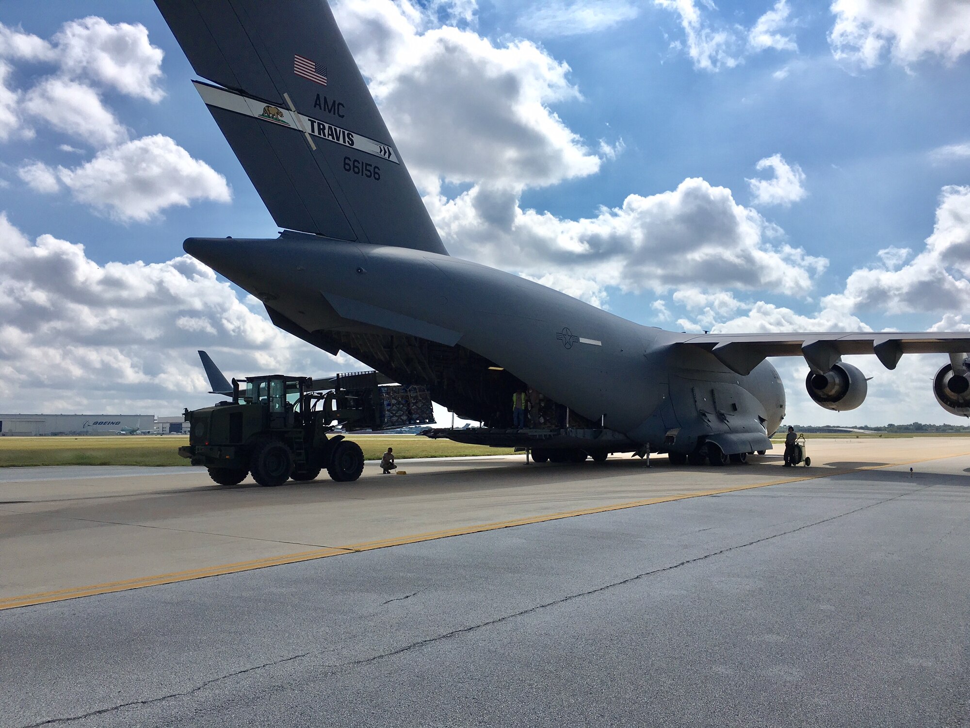Airman from the 502nd Logistics Readiness Squadron load relief supplies aboard a C-17 Galaxy Sept. 22, 2017 at Joint Base San Antonio-Kelly Field.  The C-17, from the 21st Airlift Squadron at Travis Air Force Base, Calif., was bound for St. Croix, U.S.  Virgin Islands, to aid in Hurricane Maria relief efforts.  (U.S. Air Force image/Dan Hawkins)
