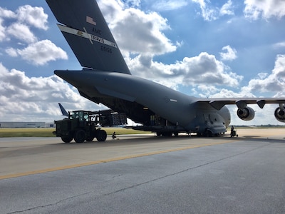 Airman from the 502nd Logistics Readiness Squadron load relief supplies aboard a C-17 Galaxy Sept. 22, 2017 at Joint Base San Antonio-Kelly Field.  The C-17, from the 21st Airlift Squadron at Travis Air Force Base, Calif., was bound for St. Croix, U.S.  Virgin Islands, to aid in Hurricane Maria relief efforts.  (U.S. Air Force image/Dan Hawkins)