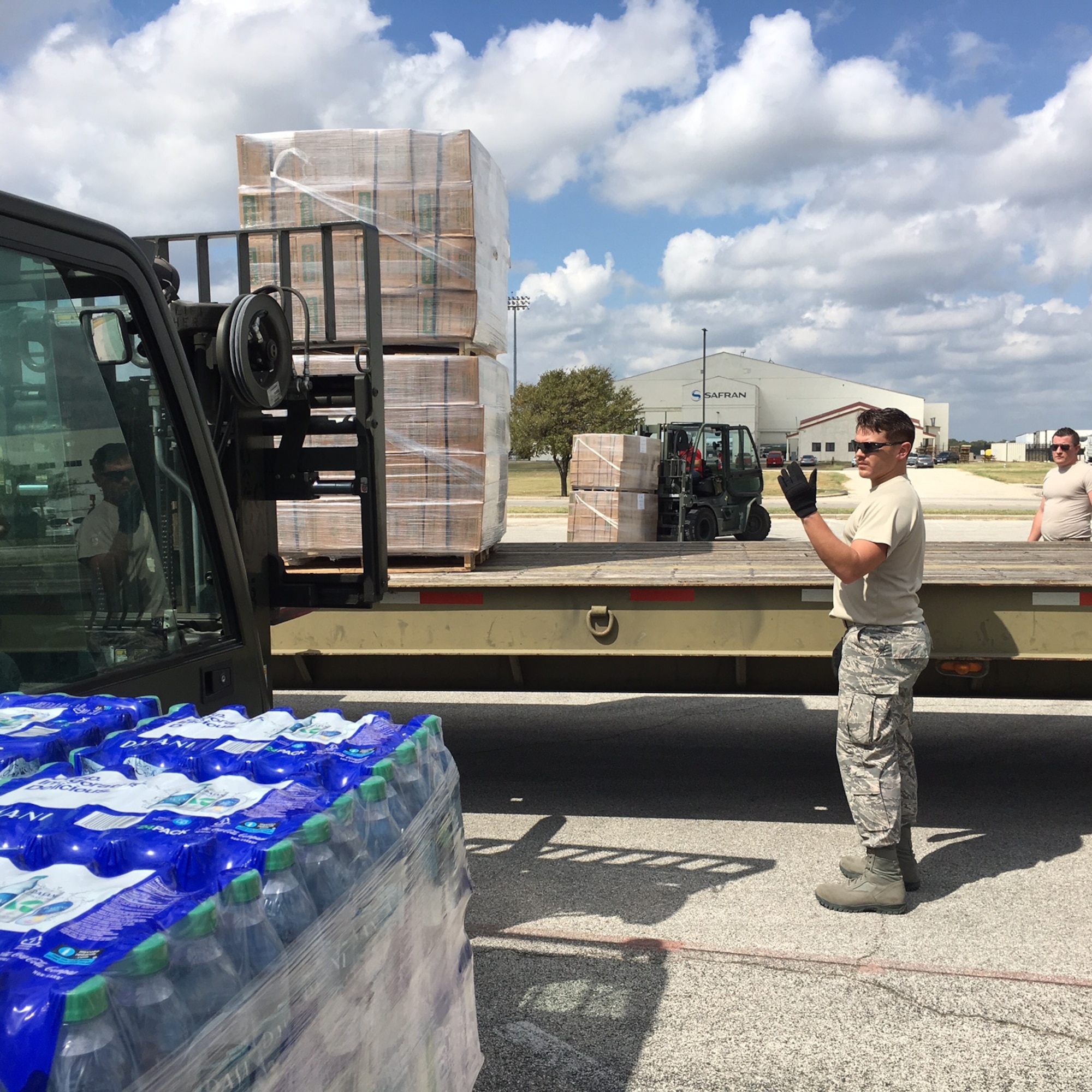 Second Lt. Alberto, 12th Training Squadron student, helps load relief supplies in preparation for air transport Sept. 22, 2017 at Joint Base San Antonio-Kelly Field.  The supplies were being staged at the Federal Emergency Management Agency’s Incident Support Base at Kelly for transport to areas devastated by Hurricane Maria. (U.S. Air Force image/Dan Hawkins)