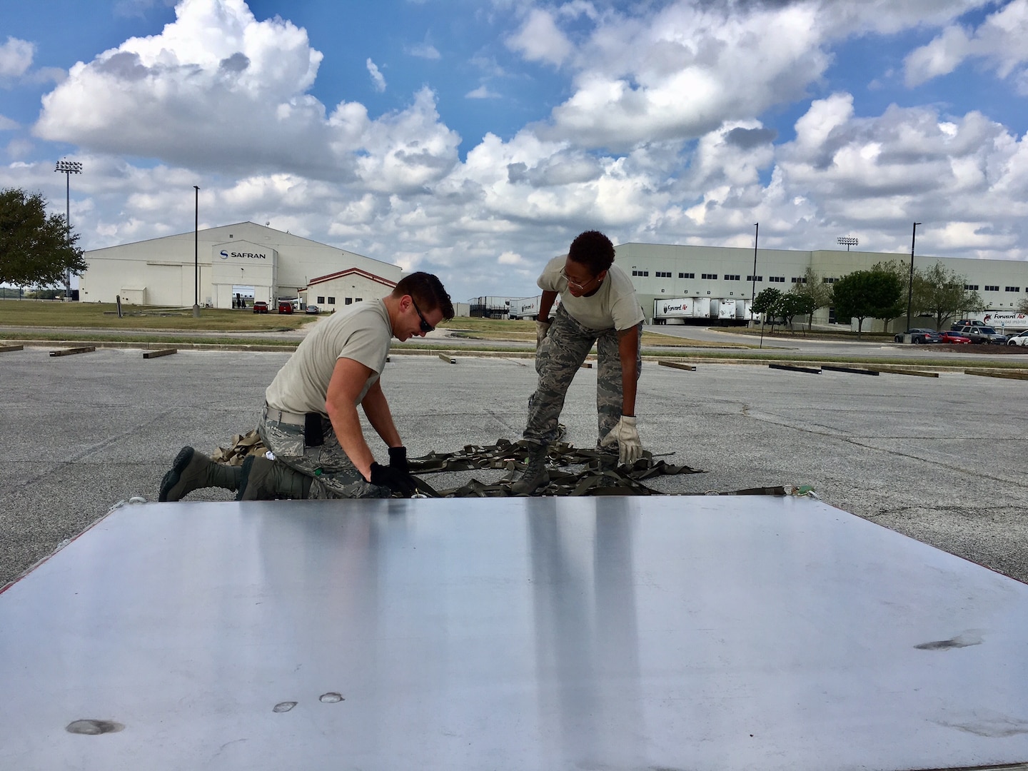 12th Training Squadron students help prepare a pallet for air transport Sept. 22, 2017 at Joint Base San Antonio-Kelly Field.  The supplies were being staged at the Federal Emergency Management Agency’s Incident Support Base at Kelly for transport to areas devastated by Hurricane Maria (U.S. Air Force image/Dan Hawkins)