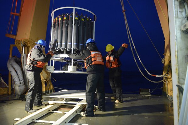 MSTC Winegar gives the signal to bring in the CTD rosette from over the side and set it on deck.