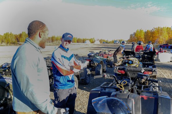 U.S. Air Force Airman 1st Class Isaac Johnson, a 354th Fighter Wing photojournalist, speaks to an all-terrain vehicle (ATV) safety course instructor during training Sept. 14, 2017, at Eielson Air Force Base, Alaska. After the class, seven Airmen stationed at Eielson received their certification to train ATV safety. (U.S. Air Force photo by Airman 1st Class Eric M. Fisher)