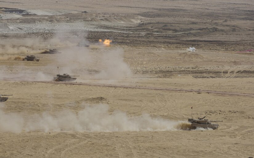 A wave of Egyptian M1A1 Abrams tanks rolls onto a simulated battlefield during the final combined arms live fire exercise of Bright Star 2017. Exercise Bright Star 2017 is a bilateral U.S. Central Command command-post exercise, field training exercise and senior leader seminar, held with the Arab Republic of Egypt. Participation strengthens military-to-military relationships between U.S. and Egyptian forces in the Central Command area of responsibility. The exercise enhances regional security and stability by responding to modern-day security scenarios. (U.S. Department of Defense photo by Tom Gagnier)