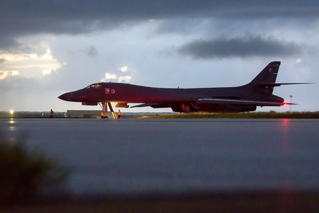 An aircraft sits on a runway.