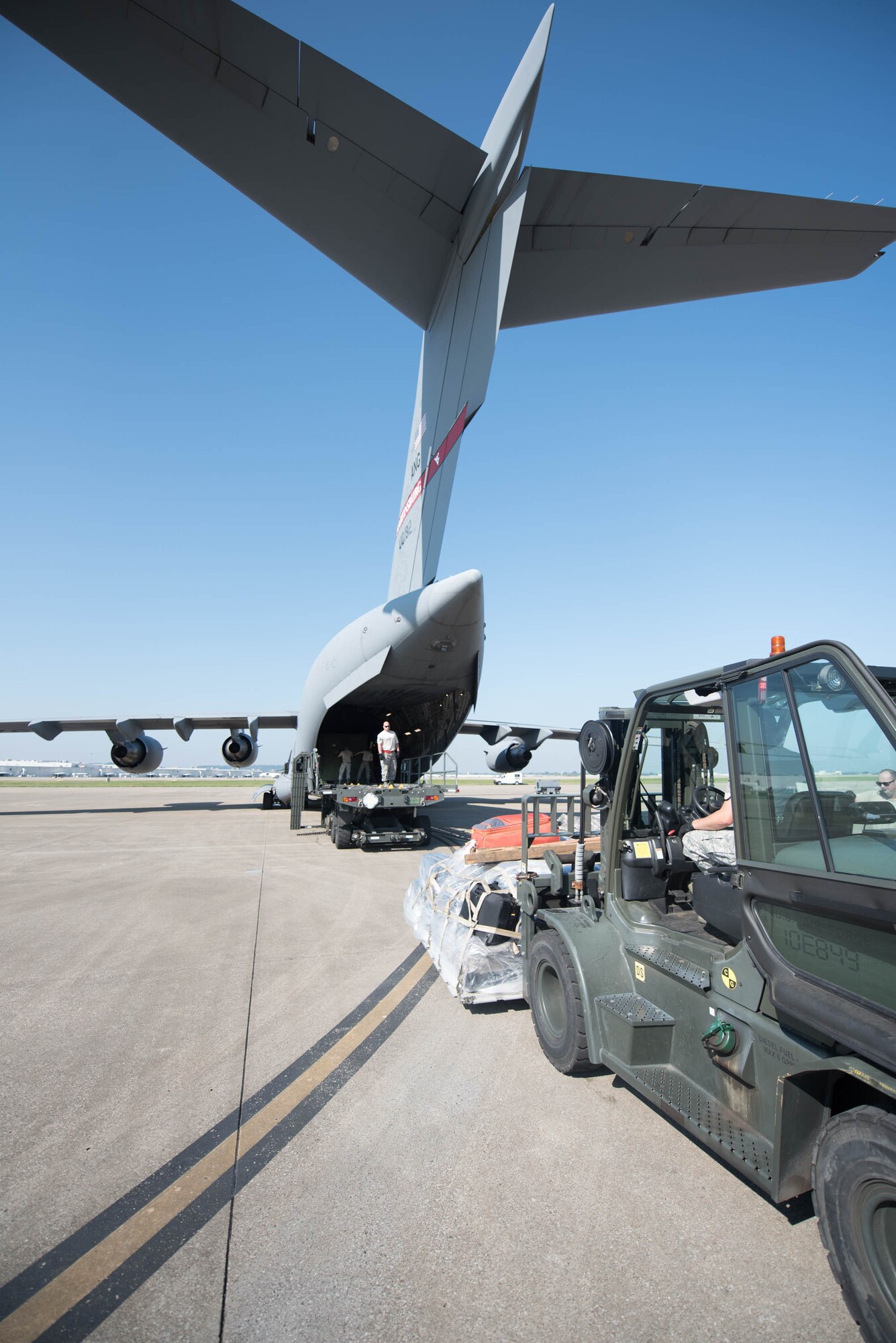 Airmen from the 123rd Airlift Wing load equipment onto a West Virginia Air National Guard C-17 at the Kentucky Air National Guard Base in Louisville, Ky., Sept 23, 2017, in support of Hurricane Maria recovery operations. Thirty-two members of the Kentucky Air National Guard’s 123rd Contingency Response Group are deploying to San Juan, Puerto Rico, along with the equipment to establish an air cargo hub to process relief supplies.