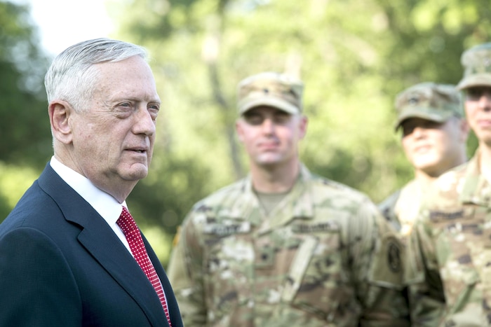 Defense Secretary Jim Mattis stands with a group of soldiers.