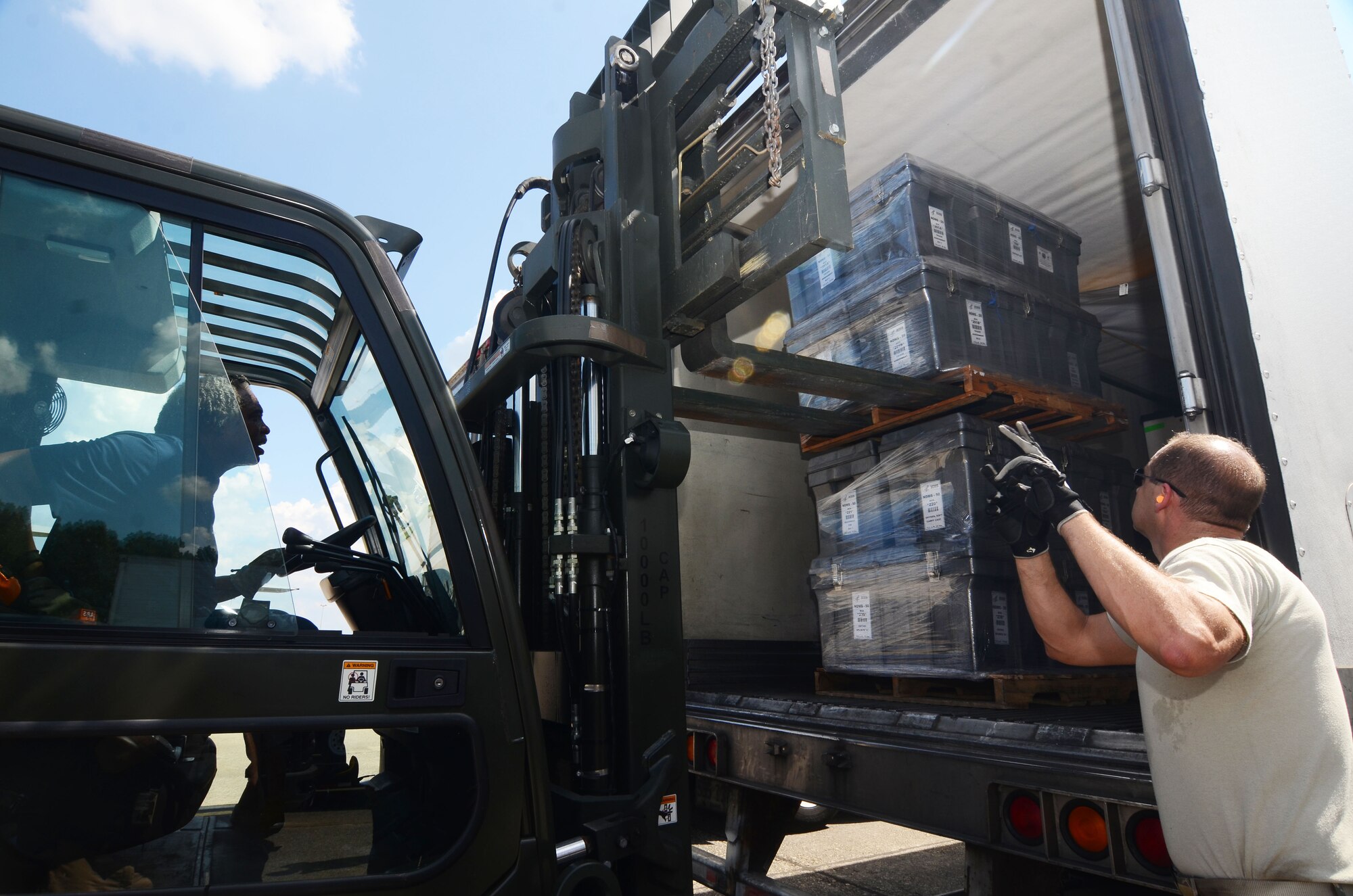 A forklift driver unload pallets of medical supplies from the back of a semi-truck at Dobbins Air Reserve Base, Ga. Sept. 21, 2017. This cargo included items needed to build a hospital from scratch – everything from the tents required to house the temporary structure to the medical equipment used to treat patients. (U.S. Air Force photo/Don Peek)