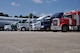 Semi-trucks line up on the flightline at Dobbins Air Reserve Base, Ga. Sept. 21, 2017 and wait to be offloaded. The trucks transported various supplies from all over the country to Dobbins where they were palletized and loaded onto C-17 Globemaster III aircraft and flown to provide hurricane relief. (U.S. Air Force photo/Tech. Sgt. Kelly Goonan)