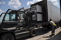 80th Aerial Port Squadron Airmen assist members of the Disaster Medical Assistance Team with the palletizing of medical supplies, meals ready-to-eat and other essential supplies on Dobbins Air Reserve Base, Ga., Sept. 21. These supplies will be taken to Puerto Rico to aid the victims of Hurricane Maria. (U.S. Air Force photo by Tech. Sgt. Kelly Goonan/released)