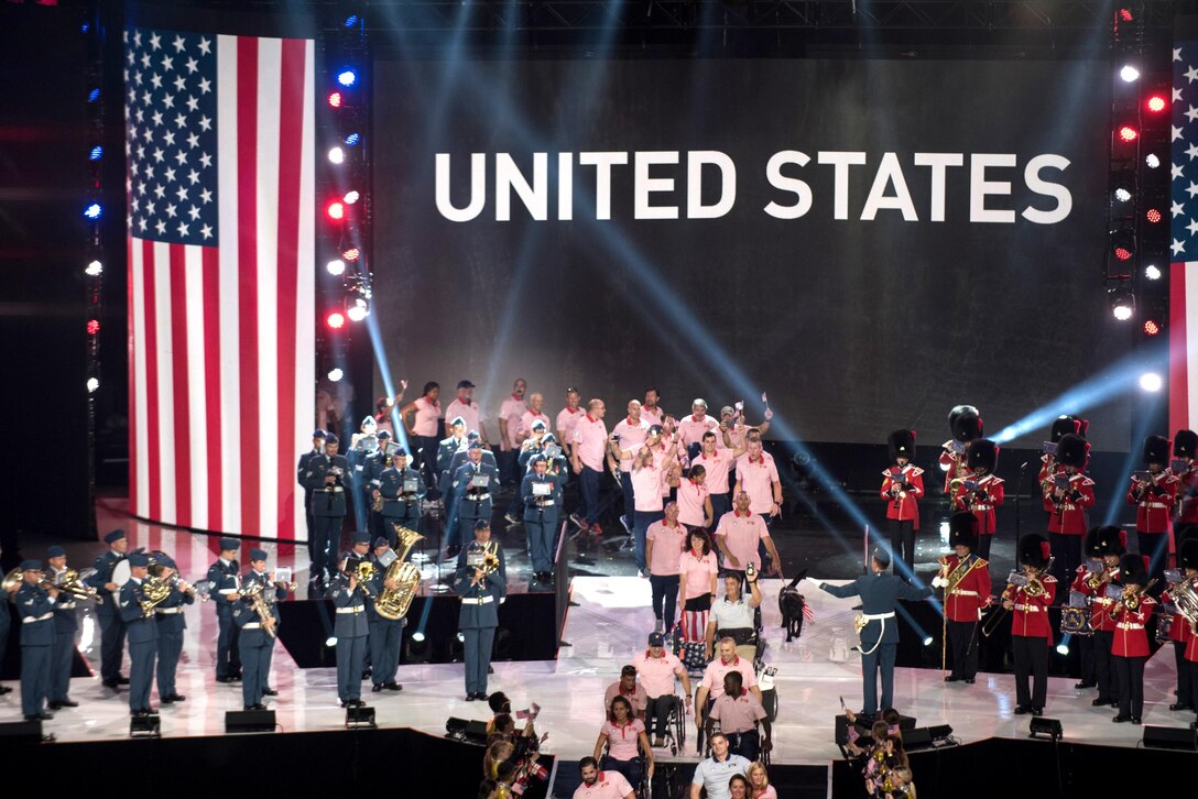 Members of the U.S. team parade across the stage.