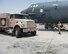 A U.S. Air Force crew chief with the 69th Expeditionary Aircraft Maintenance Unit marshals a fuel truck from the 379th Expeditionary Logistics Readiness Squadron, Fuels Management Flight, into position at Al Udeid Air Base, Qatar, Sept. 14, 2017.
