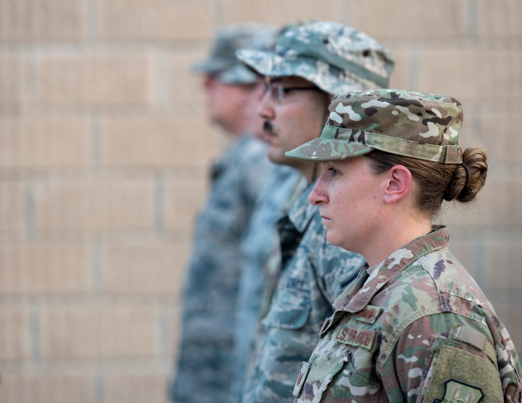 U.S. Air Force Airmen stationed at Al Udeid Air Base, Qatar gather together and take part in a 9/11 retreat ceremony at Al Udeid Air Base, Sept. 11, 2017