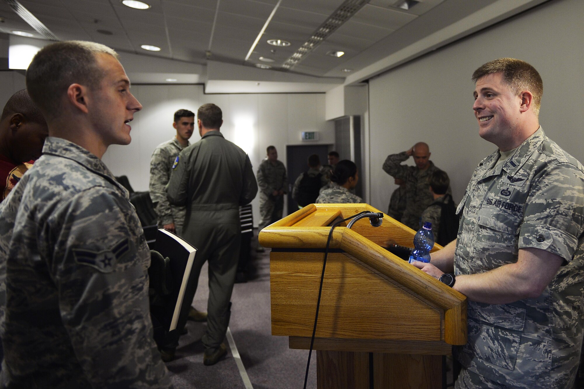 1st Lt. Matthew Barnett, 693rd Intelligence, Surveillance, and Reconnaissance Group executive officer, right, speaks with an Airmen during a commissioning town hall on Ramstein Air Base, Germany, Sept. 21, 2017. The Ramstein Education Office teamed up with Air Force company grade officers from around the area to conduct the event for Airmen interested in commissioning as officers in the Air Force. (U.S. Air Force photo by Airman 1st Class Joshua Magbanua)