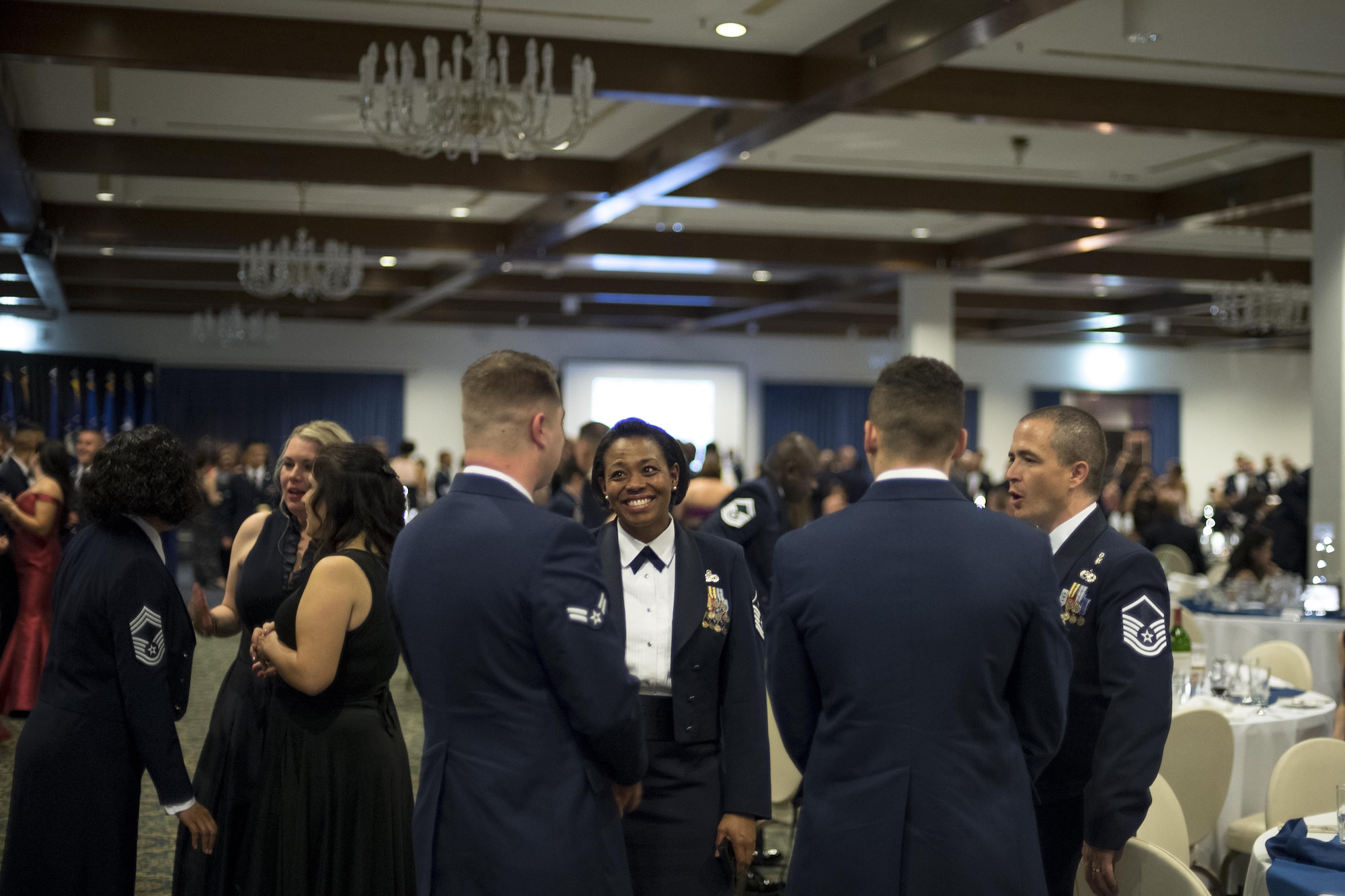 U.S. Airmen socialize during the Air Force Ball at the officer’s club on Ramstein Air Base, Germany, Sept. 23, 2017.