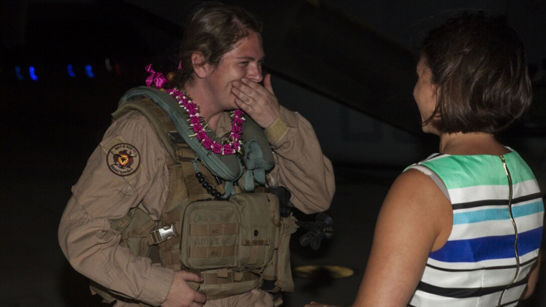 Capt. Ashley Myers, an aircraft commander with Marine Medium Tiltrotor Squadron 268, nicknamed the “Red Dragons,” is greeted by a family member after completing a trans-Pacific flight from Australia, Marine Corps Base Hawaii, Sept. 19, 2017. The “Red Dragons” supported the Australian Defence Force as the aviation combat element for the Marine Air-Ground Task Force with Marine Rotational Force Darwin, Australia. These are the first Trans-Pacific flights the MV-22 Ospreys have conducted from Hawaii to Australia. This movement demonstrates that the unfueled range of our MV-22s combined with our refueling capabilities allow us to reach across the entire Pacific Ocean. The U.S. Marine Corps can get it's aircraft and personnel to a crisis on the other side of the world in a matter of days.