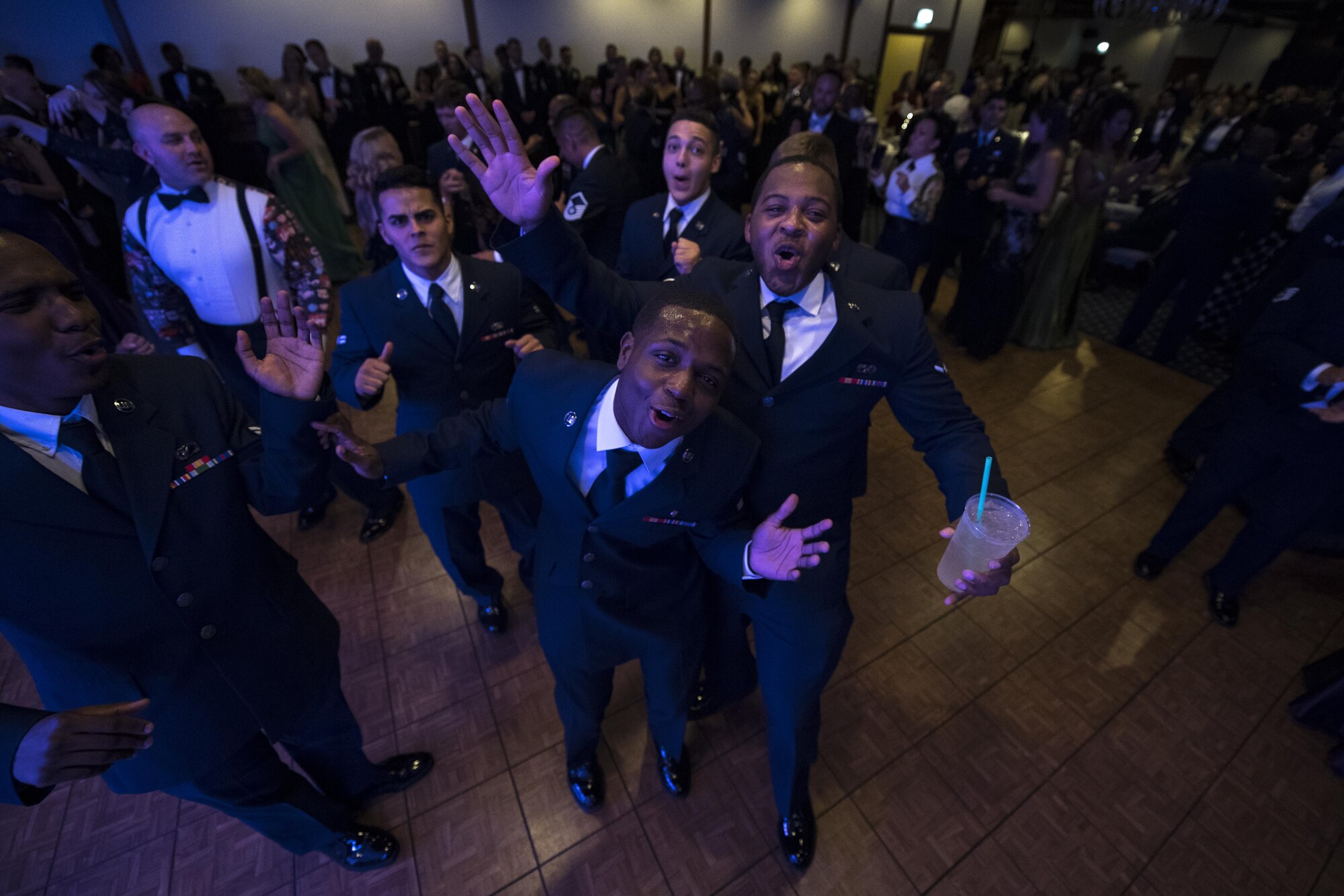 U.S. Airmen dance in a group during the Air Force Ball at the officer’s club on Ramstein Air Base, Germany, Sept. 23, 2017.