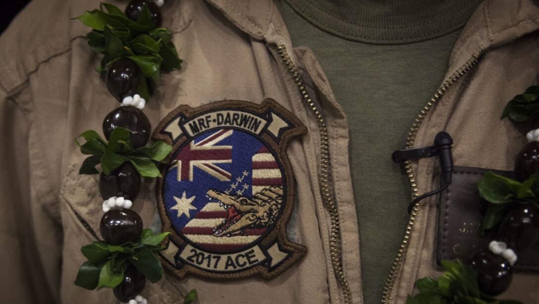 Capt. Joseph Raines, a pilot training officer with Marine Medium Tiltrotor Squadron 268, nicknamed the “Red Dragons,” wears his unit patch after completing a trans-Pacific flight from Australia, Marine Corps Base Hawaii , Sept. 19, 2017.
