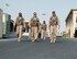 U.S. Army Gen. Joseph Votel, right, U.S. Central Command commander, walks with U.S. Air Force Airmen with the 69th Expeditionary Bomb Squadron at Al Udeid Air Base, Qatar, Sept. 8, 2017.