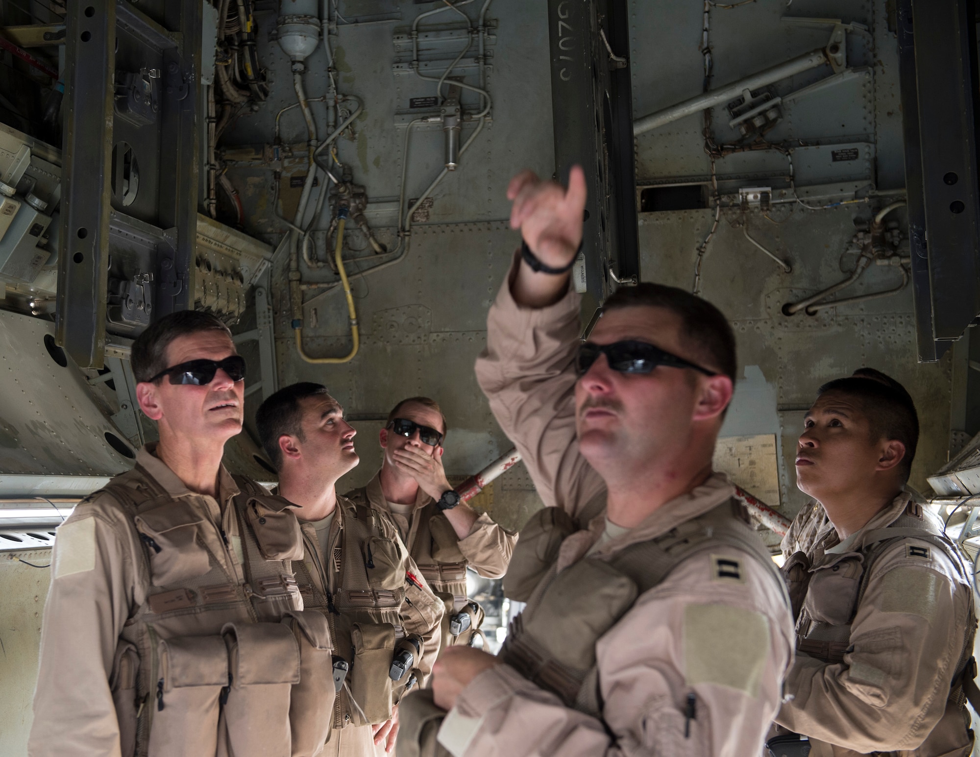 U.S. Air Force Capt. Micah McCracken, right, 69th Expeditionary Bomb Squadron aircraft commander, discusses the capabilities of a B-52 Stratofortress to U.S. Army Gen. Joseph Votel, left, U.S. Central Command commander, at Al Udeid Air Base, Qatar, Sept. 8, 2017.