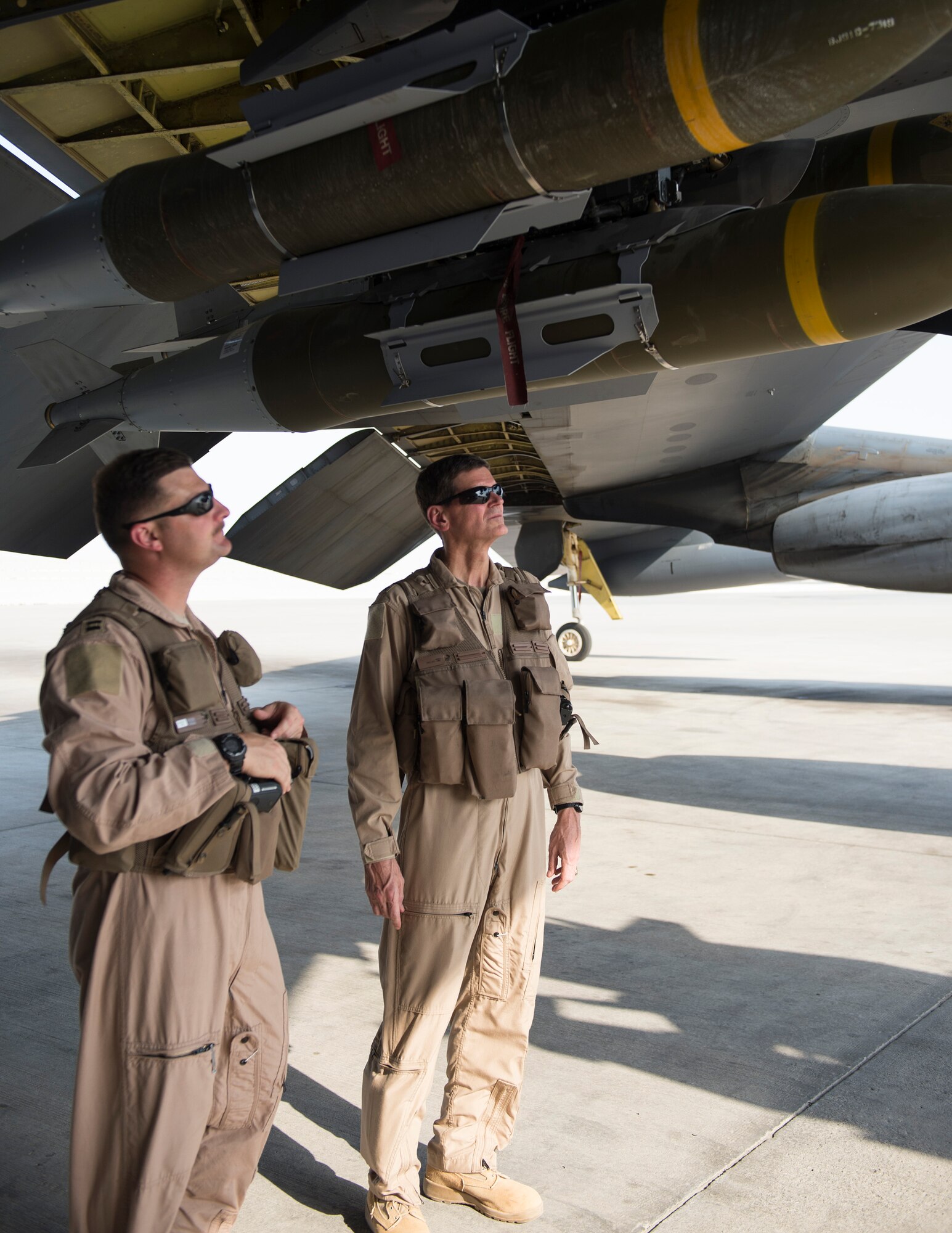 U.S. Army Gen. Joseph Votel, right, U.S. Central Command commander, listens to U.S. Air Force Capt. Micah McCracken, 69th Expeditionary Bomb Squadron aircraft commander, explain the capabilities of a B-52 Stratofortress at Al Udeid Air Base, Qatar, Sept. 8, 2017.