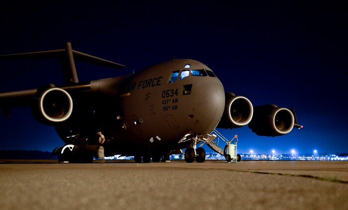 Senior Airman Kenny Phonsyry, 437th Aircraft Maintenance Squadron crew chief, performs preflight checks at Joint Base Charleston, S.C., Sept. 23, 2017. The 14th Airlift Squadron, 437th Airlift Wing, flew a mobile air traffic control tower, food and water to St. Thomas, Virgin Islands in support of Hurricane Maria relief efforts.