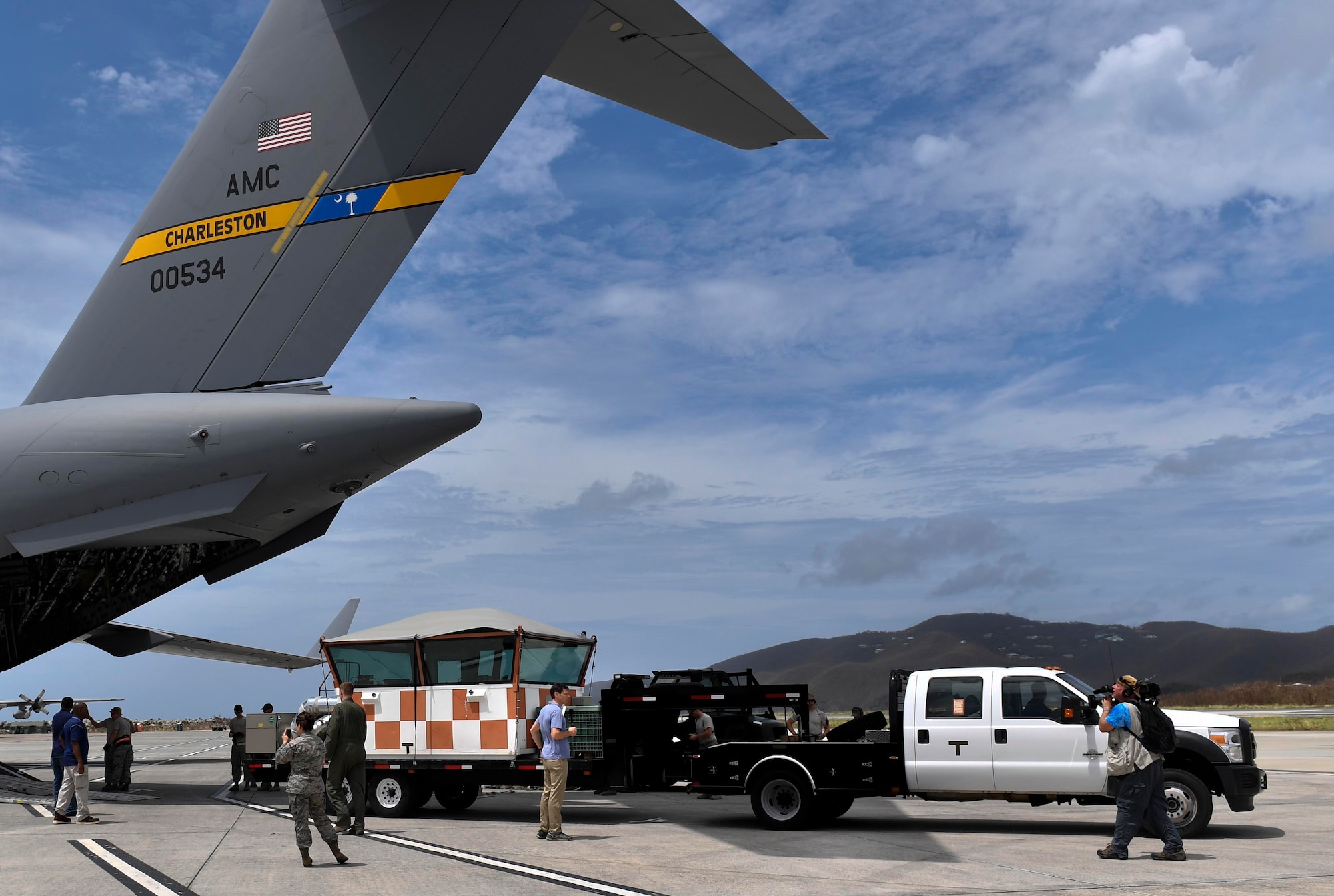 A mobile air traffic control tower is unloaded from a Joint Base Charleston C-17 Globemaster III in St. Thomas, Virgin Islands, Sept. 23, 2017. The 14th Airlift Squadron, 437th Airlift Wing, flew a mobile air traffic control tower, food and water to St. Thomas in support of Hurricane Maria relief efforts.