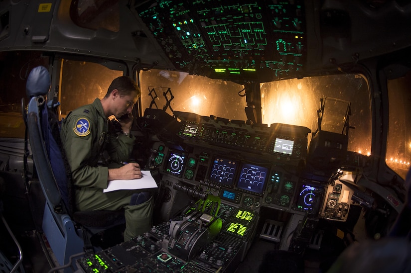 Capt. Woody Sukut, a C-17 pilot from the 14th Airlift Squadron, 437th Airlift Wing, verifies cargo details Sept. 23, 2017, at Joint Base Charleston, S.C. Airmen from JB Charleston provided relief efforts to those recently affected by Hurricanes Irma and Maria. The cargo included pallets of meals ready to eat, cases of water and a stand-up air traffic mobile control tower to support the relief operations at St. Thomas Cyril E. King Airport.