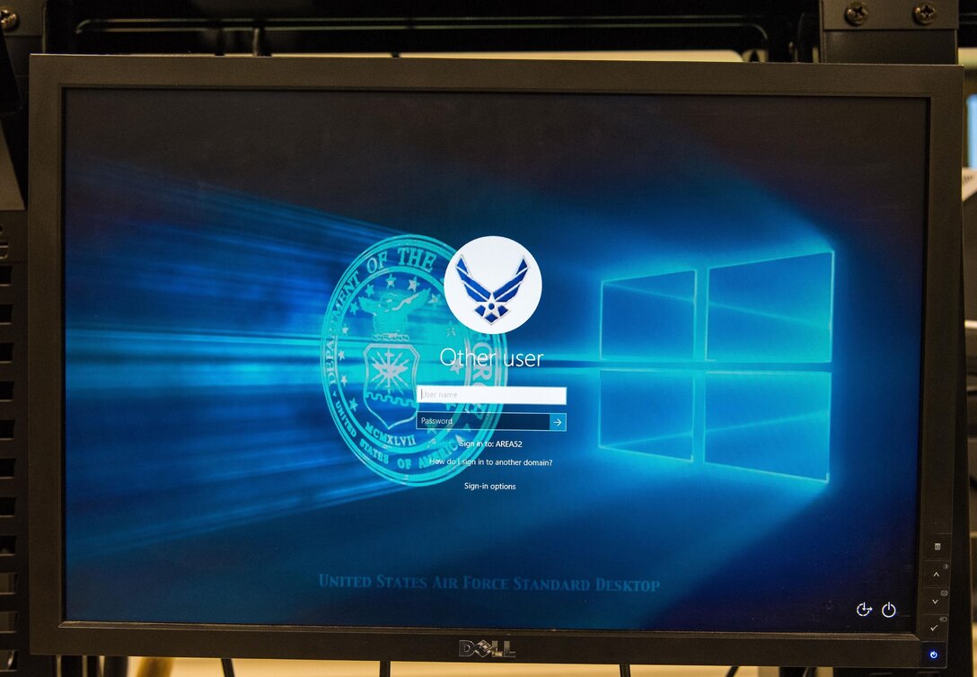 A monitor displays the new log in screen of a computer running Windows 10 Secure Host Baseline version 5.3 during the process of upgrading computers Sept. 7, 2017, on Dover Air Force Base, Del. The upgrade from Windows 7 to Windows 10 and the use of a single operating system across the Department of Defense will help improve cybersecurity and help reduce information technology costs. (U.S. Air Force photo by Roland Balik)