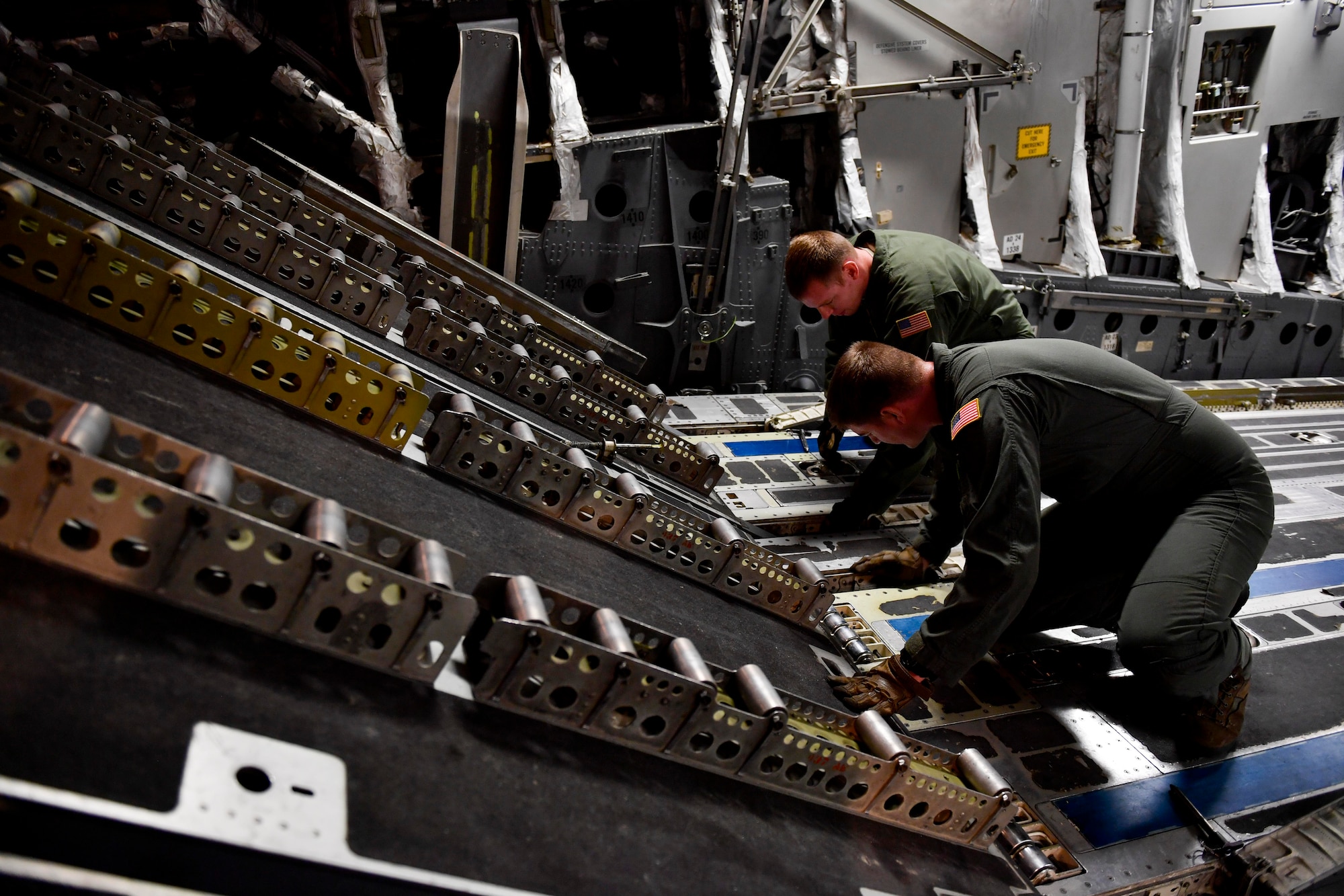 Tech. Sgt. Bill Elliot, left, and Senior Airman Mark Darnell, right, 14th Airlift Squadron loadmaster from Joint Base Charleston S.C., prepare a C-17 Globemaster III for a cargo upload at Kelly field in San Antonio, Texas, Sept. 24, 2017. Members of the 14th AS delivered more than 129,000 pounds of food and water to St. Croix, Virgin Islands in support of relief efforts after Hurricane Maria. The mission to St. Croix marked the second mission the crew flew to the Virgin Islands for humanitarian aid in 48 hours.