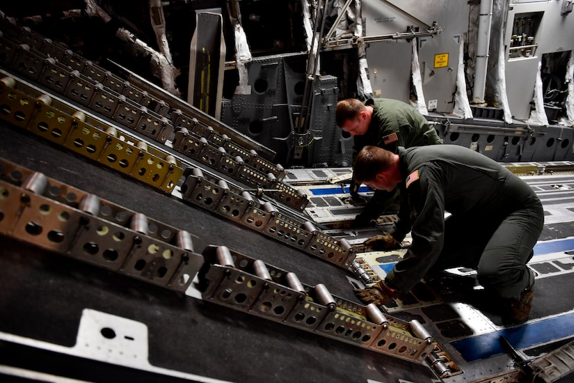 Tech. Sgt. Bill Elliot, left, and Senior Airman Mark Darnell, right, 14th Airlift Squadron loadmaster from Joint Base Charleston S.C., prepare a C-17 Globemaster III for a cargo upload at Kelly field in San Antonio, Texas, Sept. 24, 2017. Members of the 14th AS delivered more than 129,000 pounds of food and water to St. Croix, Virgin Islands in support of relief efforts after Hurricane Maria. The mission to St. Croix marked the second mission the crew flew to the Virgin Islands for humanitarian aid in 48 hours.