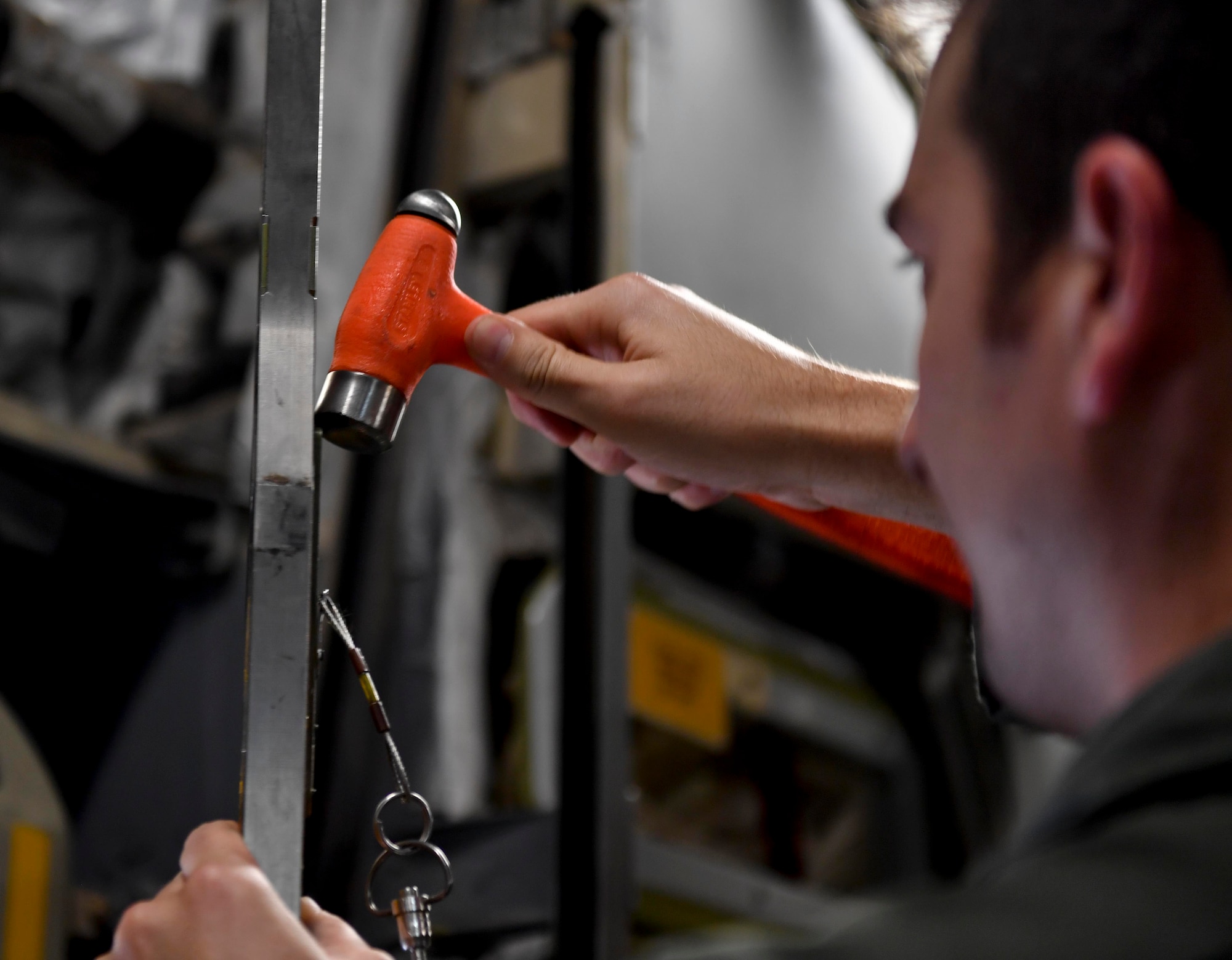 Staff Sgt. Zach Brammer, 437th Aircraft Maintenance Squadron, 437th Airlift Wing, flying crew chief, gets a plug unstuck from a link at Kelly Field in San Antonio, Texas, Sept. 24, 2017. Members of the 14th Airlift Squadron from Joint Base Charleston, S.C., delivered more than 129,000 pounds of food and water to St. Croix, Virgin Islands in support of relief efforts after Hurricane Maria. The mission to St. Croix marked the second mission the crew flew to the Virgin Islands for humanitarian aid in 48 hours.