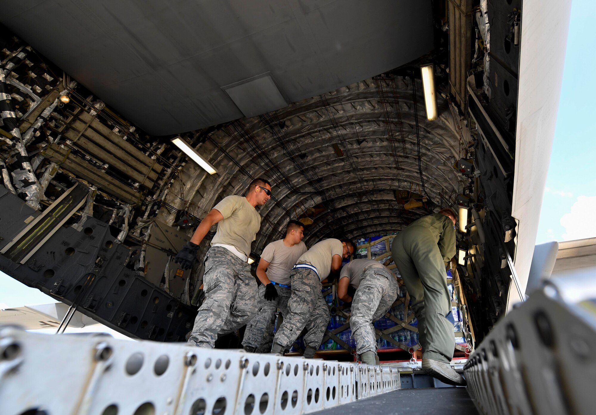 Airmen from the 502nd Logistics Readiness Squadron, from Joint Base San Antonio-Randolph, load cargo onto a C-17 Globemaster III at Kelly Field in San Antonio, Texas, Sept. 24, 2017. Members of the 14th Airlift Squadron, 437th Airlift Wing, delivered more than 129,000 pounds of food and water to St. Croix, Virgin Islands in support of relief efforts after Hurricane Maria. The mission to St. Croix marked the second mission the crew flew to the Virgin Islands for humanitarian aid in 48 hours.