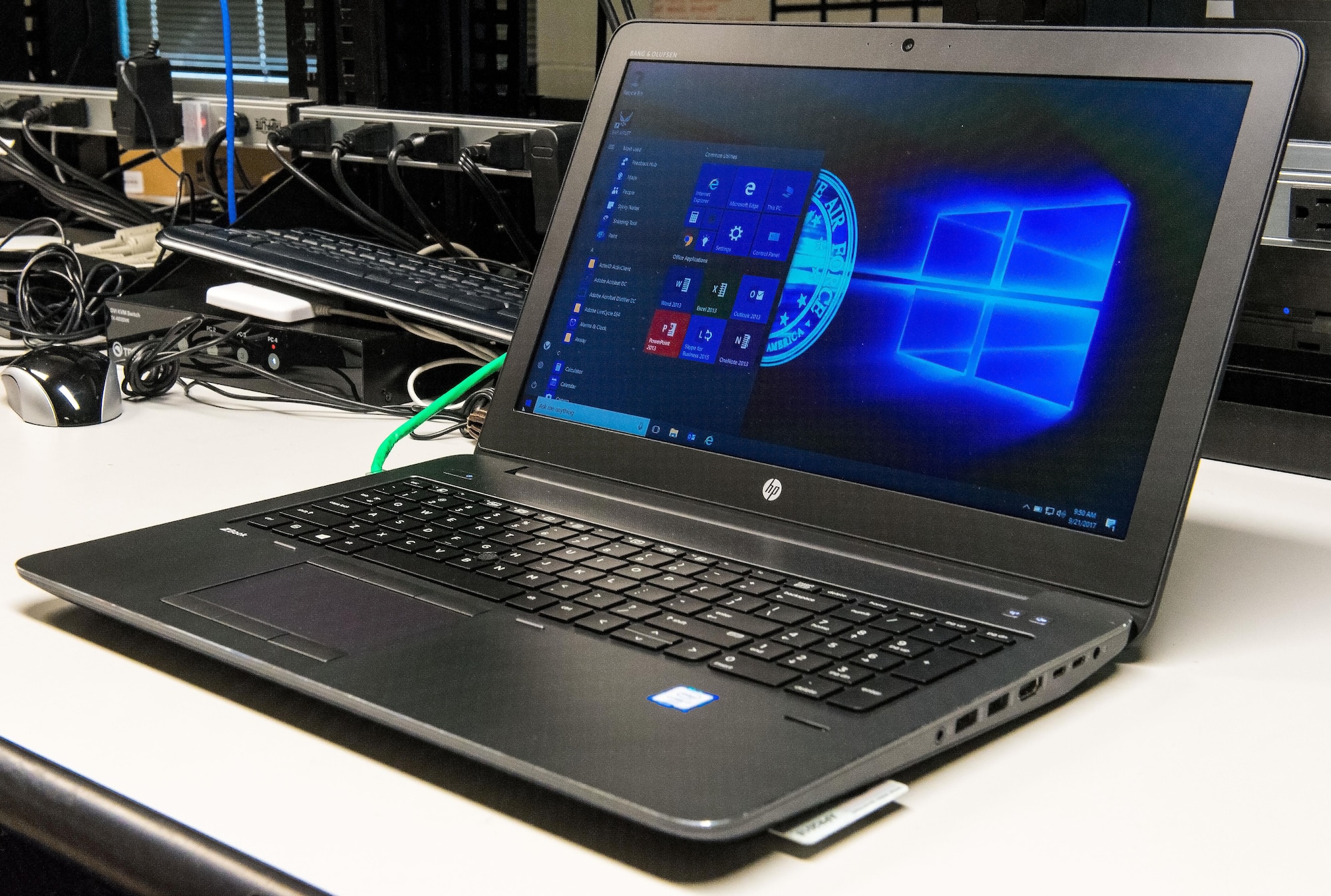 A laptop computer running Windows 10 Secure Host Baseline version 5.3 sits on the 436th Communications Squadron consolidated work bench waiting to be checked by client service technicians Sept. 21, 2017, on Dover Air Force Base, Del. The upgrade from Windows 7 to Windows 10 and the use of a single operating system across the Department of Defense will help improve cybersecurity and help reduce information technology costs. (U.S. Air Force photo by Roland Balik)