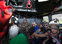 U.S. citizens prepare to take off in an MH-60S Sea Hawk helicopter in Dominica.