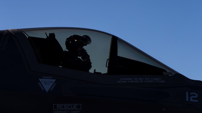 U.S. Marines with Marine Fighter Attack Squadron 121 Load Ordnance on a F-35B Lightning II