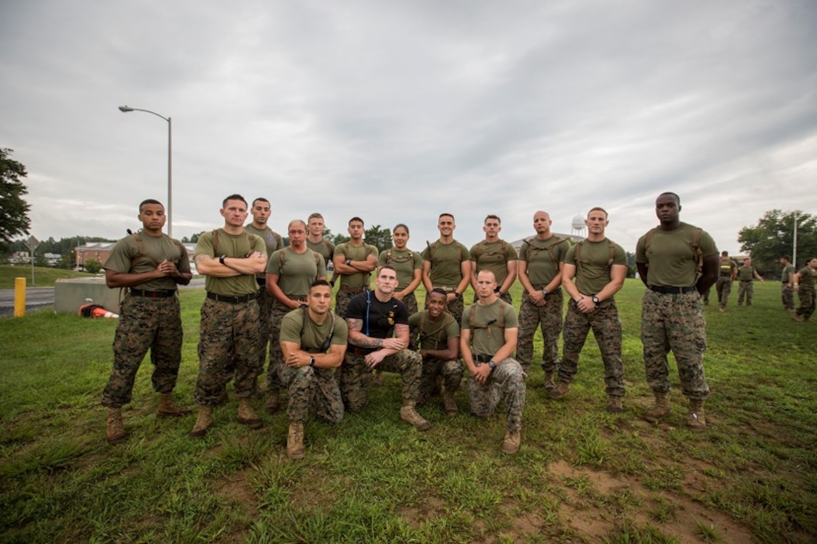 FFIT Sgt. Cody Anderson poses with student from Force Fitness Instructor Course 4-17 before beginning an intense Physical Training session.