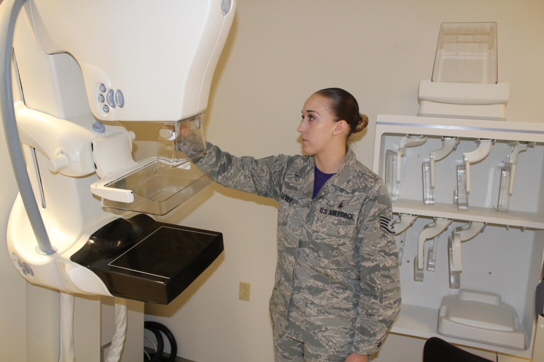 Staff Sgt. Lauren Le’vey, 88th Medical Group mammography course instructor, adjusts the mammogram machine for the next patient. According to the American College of Radiology, women should start having mammograms annually at the age of 40. Women who have immediate family members who had breast cancer should speak with their doctors about their risk and their potential need for additional screening. (U.S. Air Force Photos/Stacey Geiger)