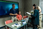 Members of the Defense Federal Community receive information during a Resiliency Resource Fair at Defense Supply Center Columbus